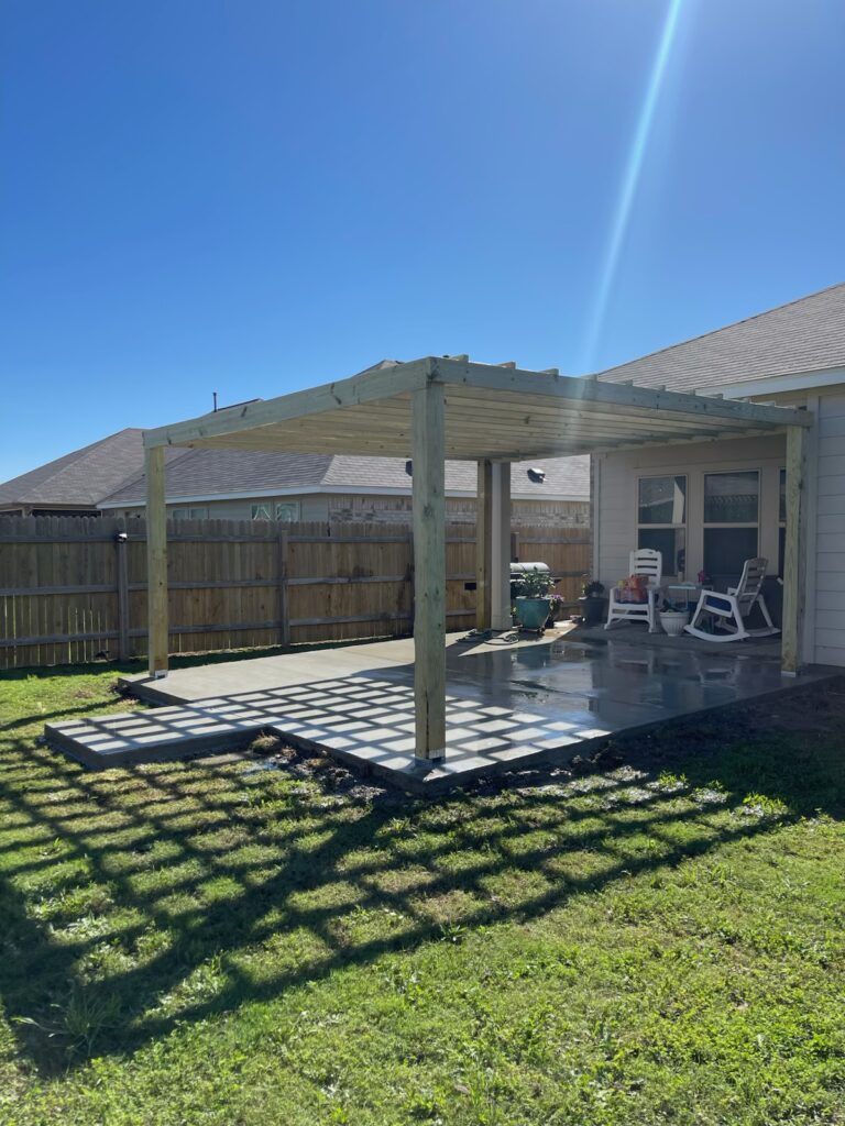 Cedar pergola built over a concrete patio by Texan Handyman Services in the Austin metro