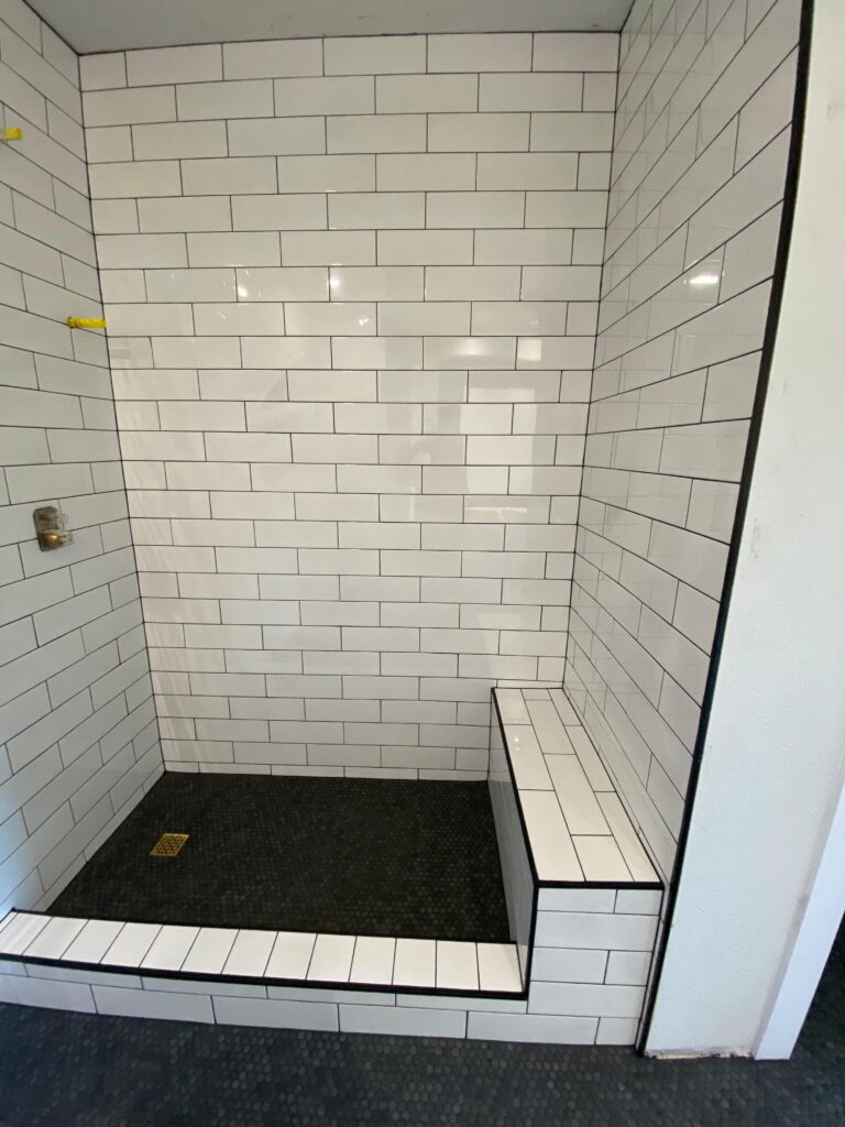 White subway tile shower with built-in bench, Hutto bathroom remodel