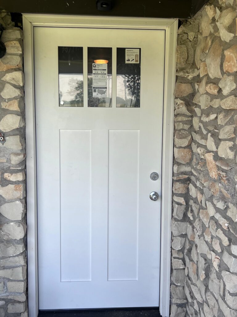 New exterior door installed in a stone entry, handyman door installation
