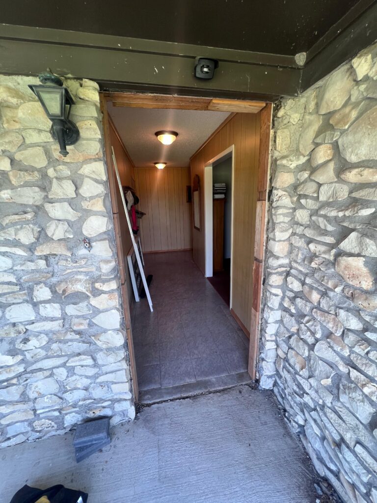 Interior hallway after door, trim and paint work by Texan Handyman Services