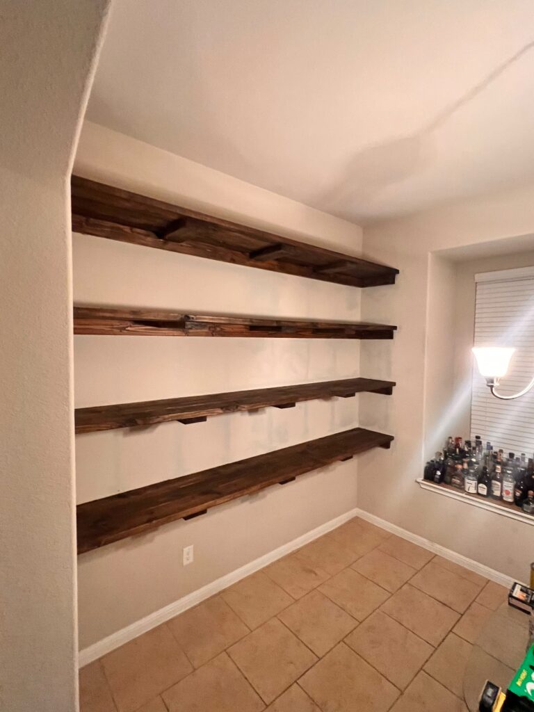 Custom floating wood shelves built and installed in Manor, TX
